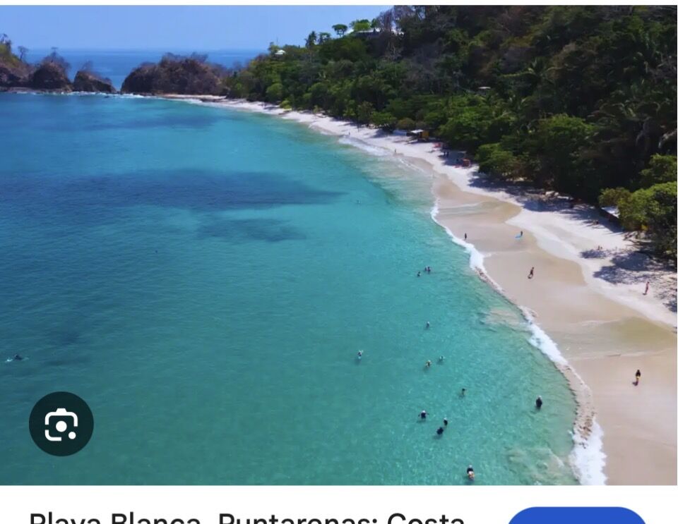 Aerial of the white sand beach and turquoise water near Jacó Costa Rica
